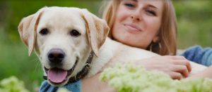 woman hugging large dog